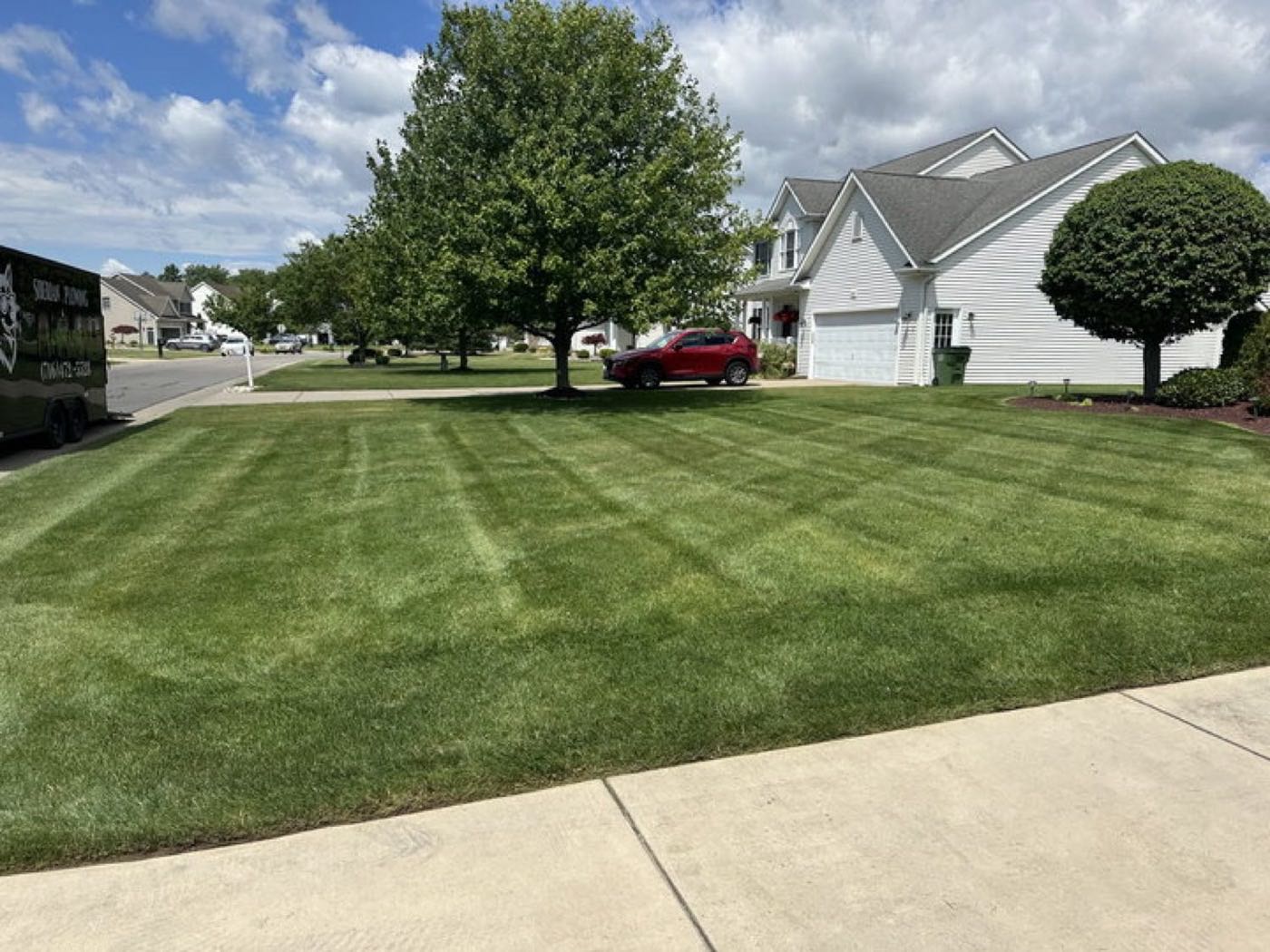 Freshly striped lawn maintained by Siberian Plowing & Landscaping in North Tonawanda