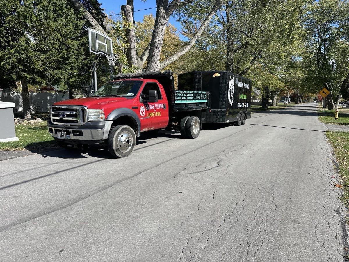 The Siberian Plowing & Landscaping truck and trailer on a North Tonawanda street